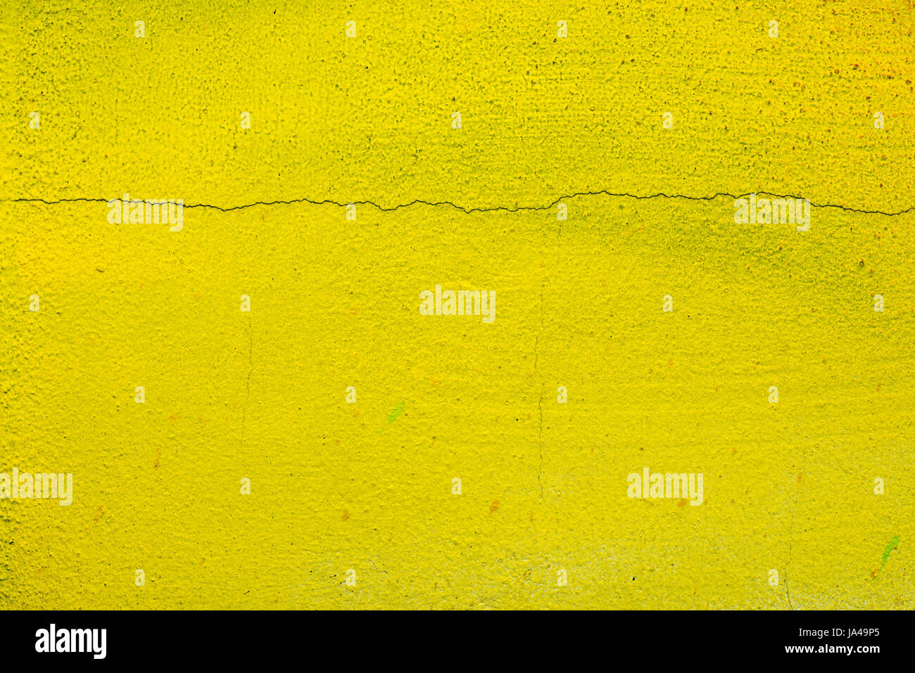 yellow color painted wall background texture Stock Photo