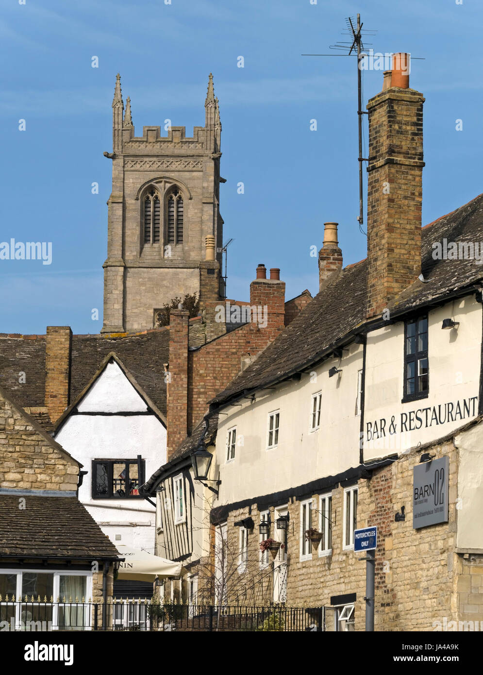 Old buildings and rooftops and St Johns Church Tower, Stamford, Lincolnshire, England, UK Stock Photo