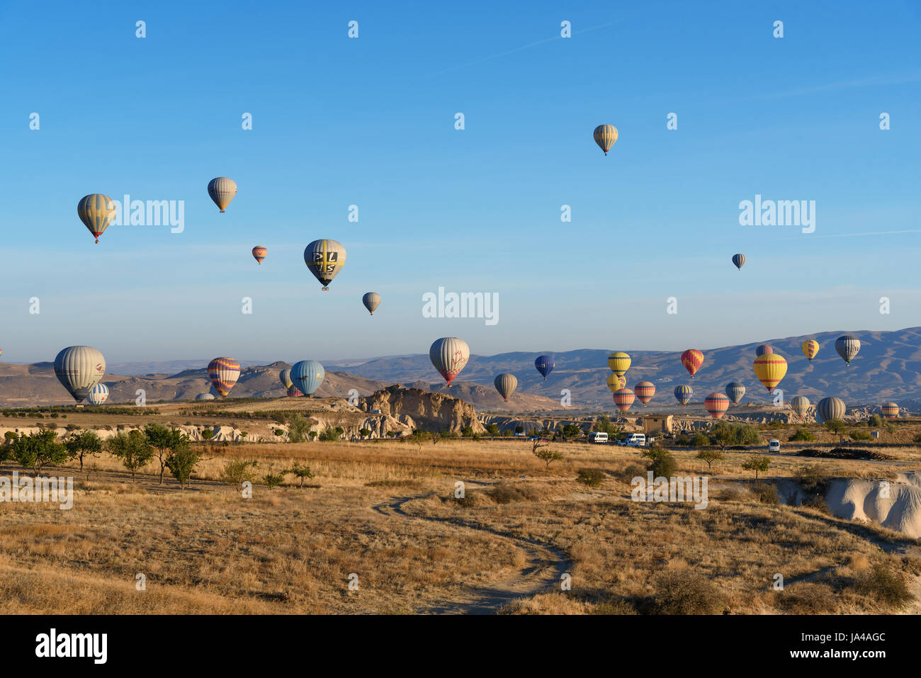 Goreme, Turkey - October 16, 2016: Hot air balloons flying over valley of Cappadocia in the morning. Nevsehir Province. Turkey. Stock Photo