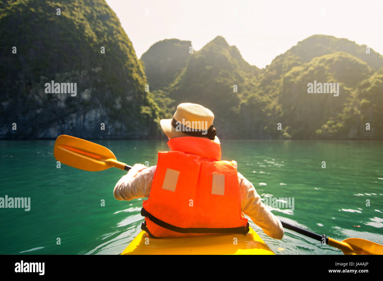 Tourist kayaking in the Halong bay seaside of Vietnam Stock Photo