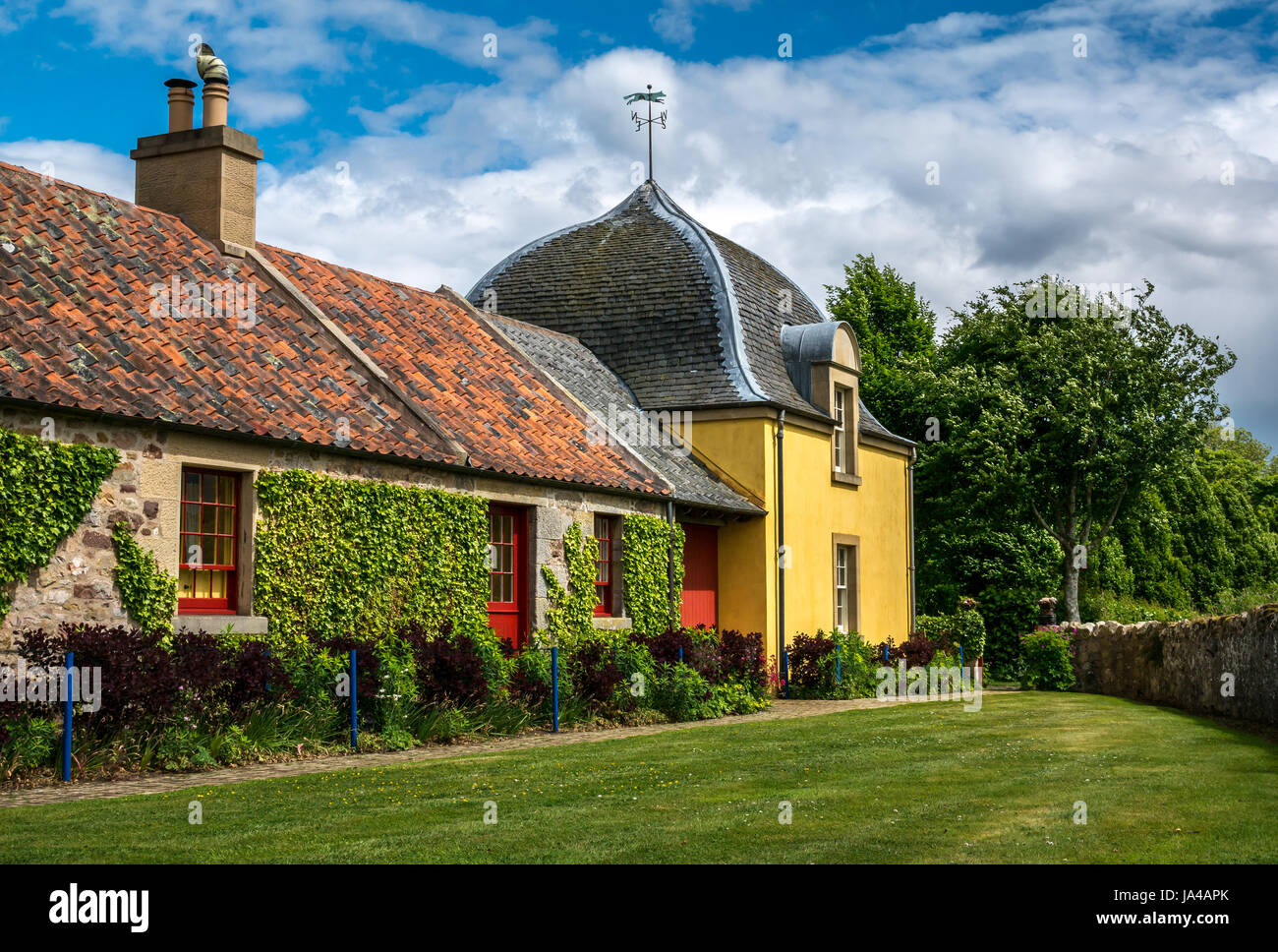 Colourful picturesque Steading farm building renovation to cottages at Broadwoodside, Gifford, East Lothian, Scotland, UK, in Summer Stock Photo