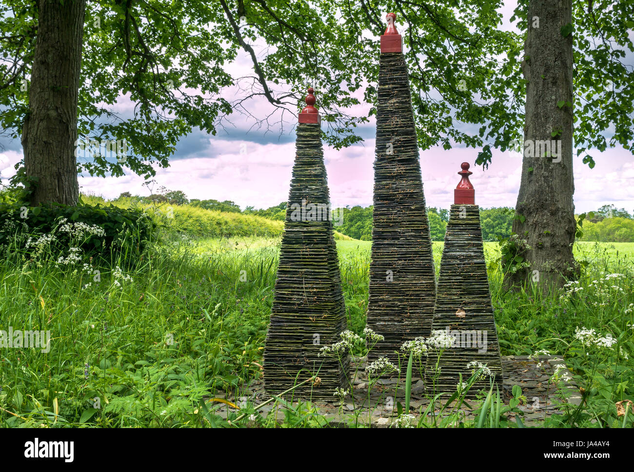 Quirky picturesque garden feature. Artwork of slate tower pinnacles at
