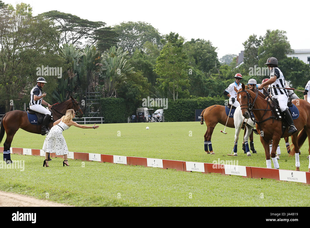 Joanne Froggatt throws a ball as Prince Harry (not pictured) takes part