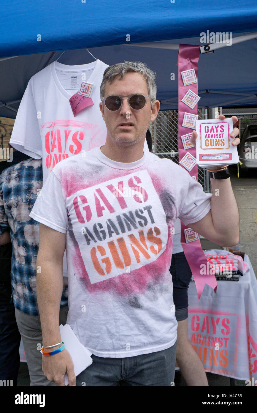 A gay man at the Queens Pride Parade in New York protesting for saner gun control laws. Stock Photo
