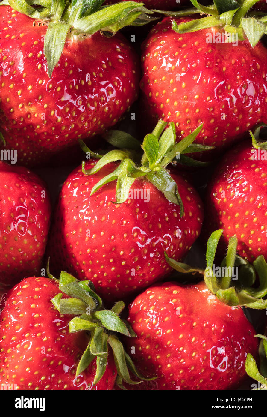 Berry background from a fresh strawberry texture closeup Stock Photo ...