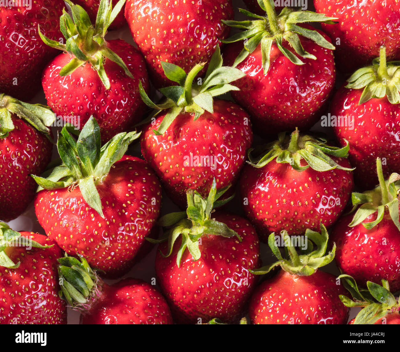 Berry background from a fresh strawberry texture closeup Stock Photo ...