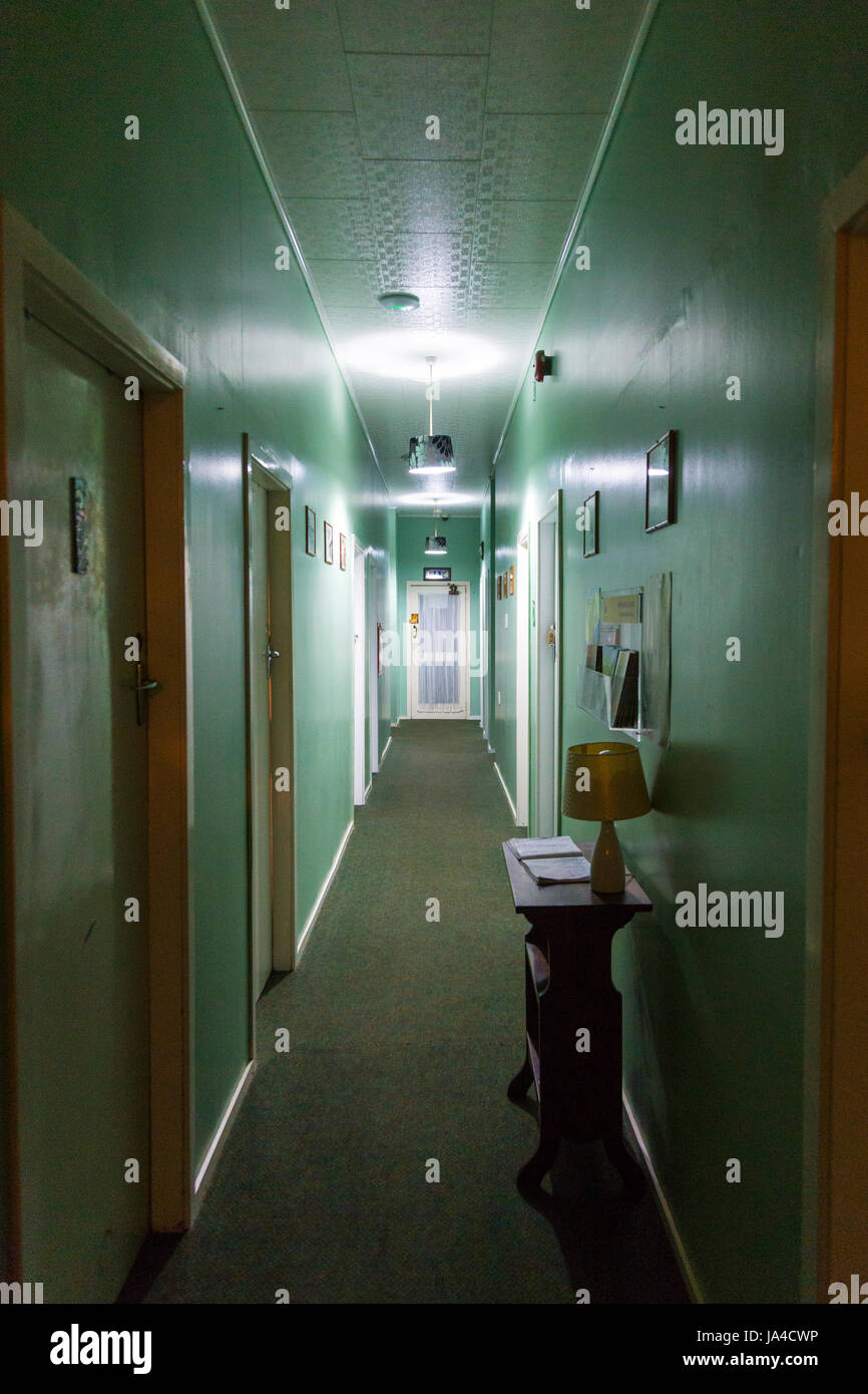 A green corridor in a motel Stock Photo