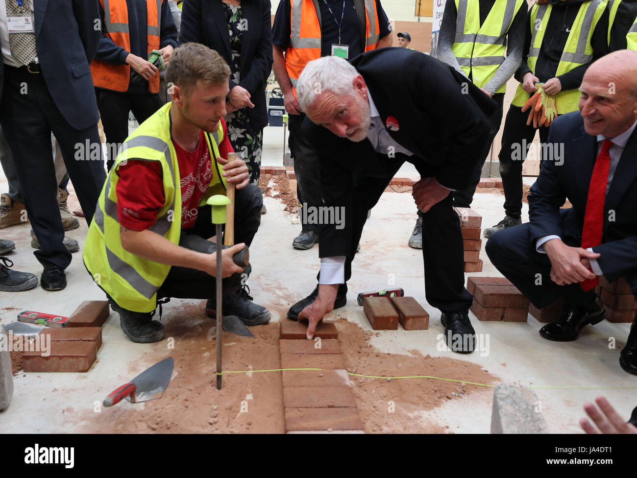 Labour leader Jeremy Corbyn laying bricks during his visit to Derwentside College in Consett, County Durham, while on the General Election campaign trail. Stock Photo