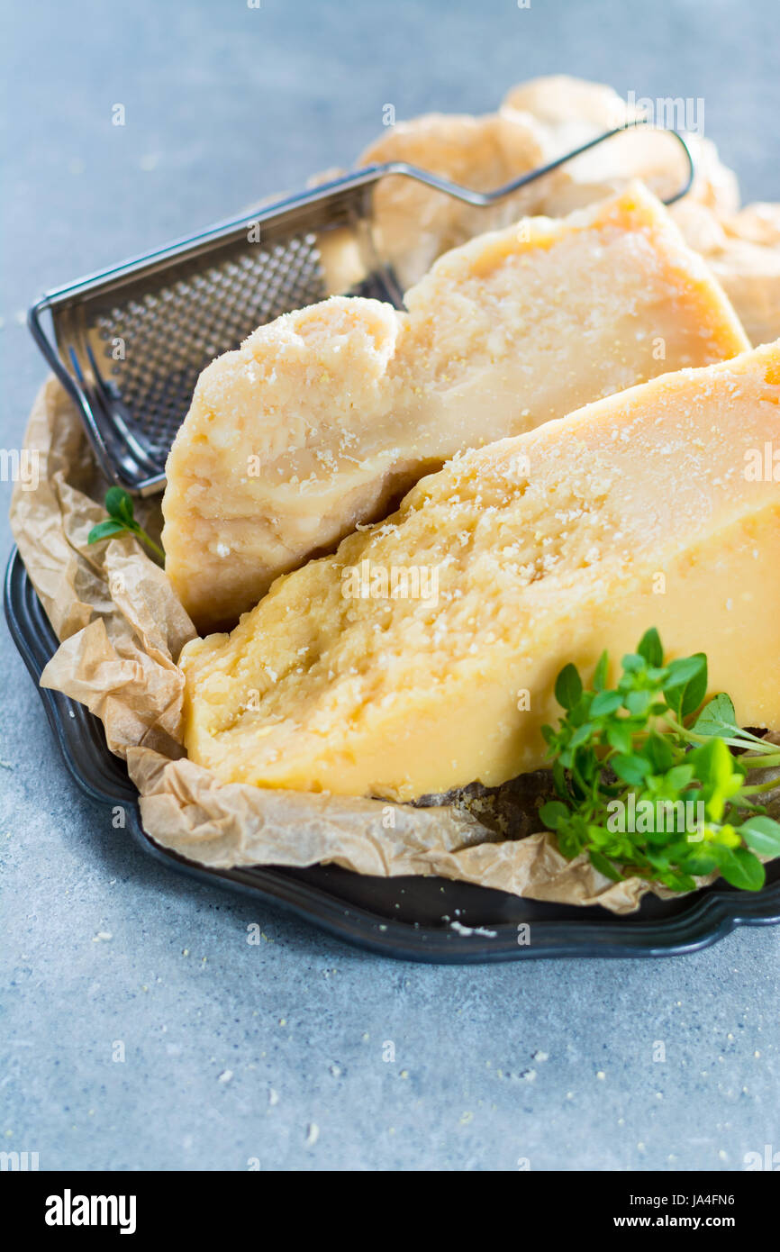 Traditional Italian hard cheese Parmesan and Grana Padano with grater