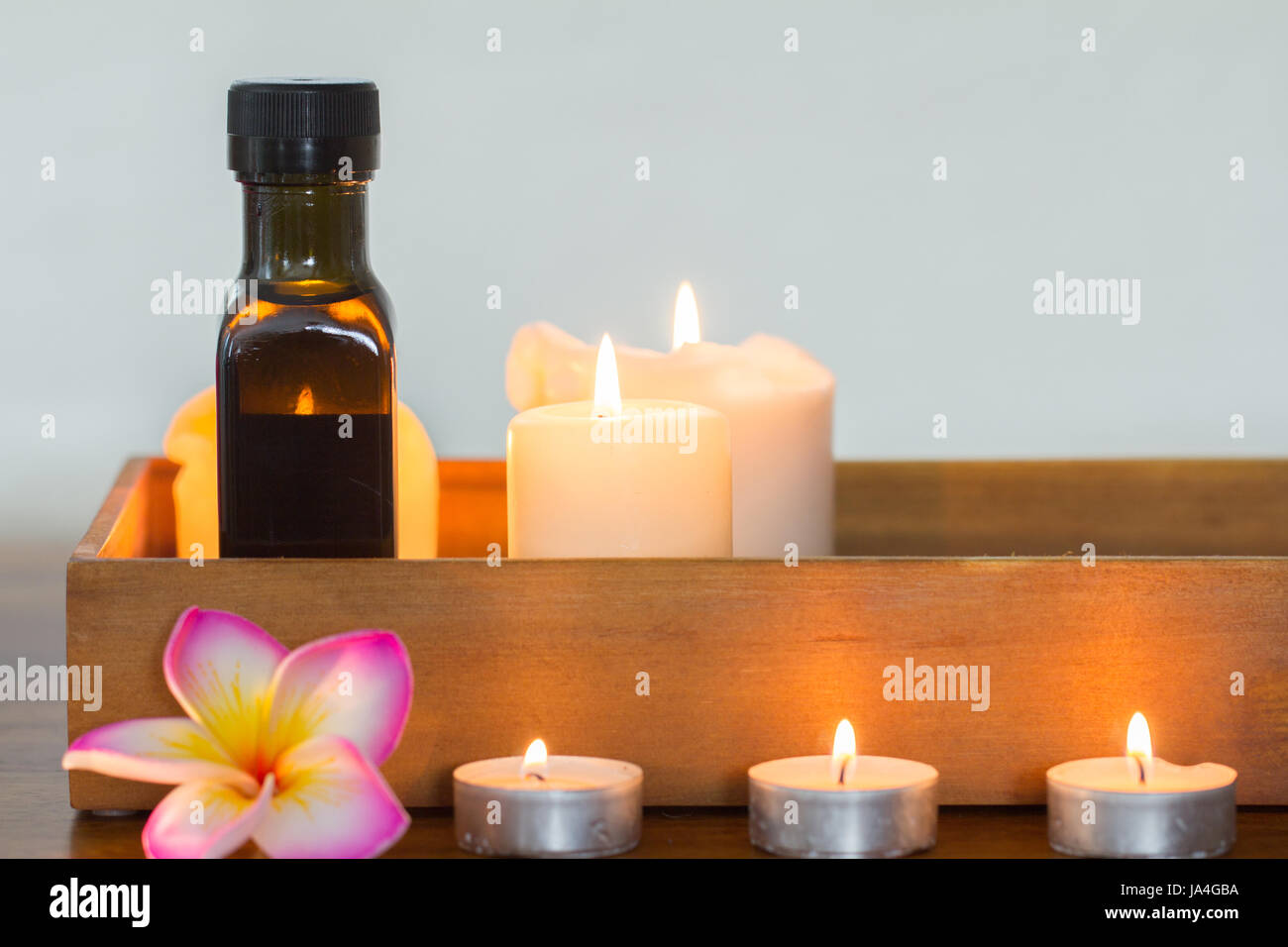 burning candles and massage oil composition Stock Photo