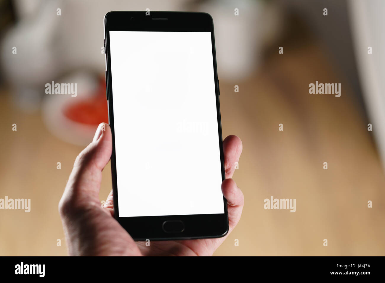 female teen hand holding smartphone with blank white screen Stock Photo ...