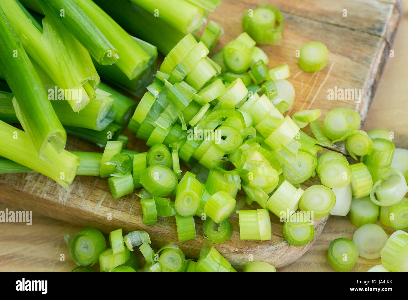 cut green onion chives on wooden background Stock Photo Alamy