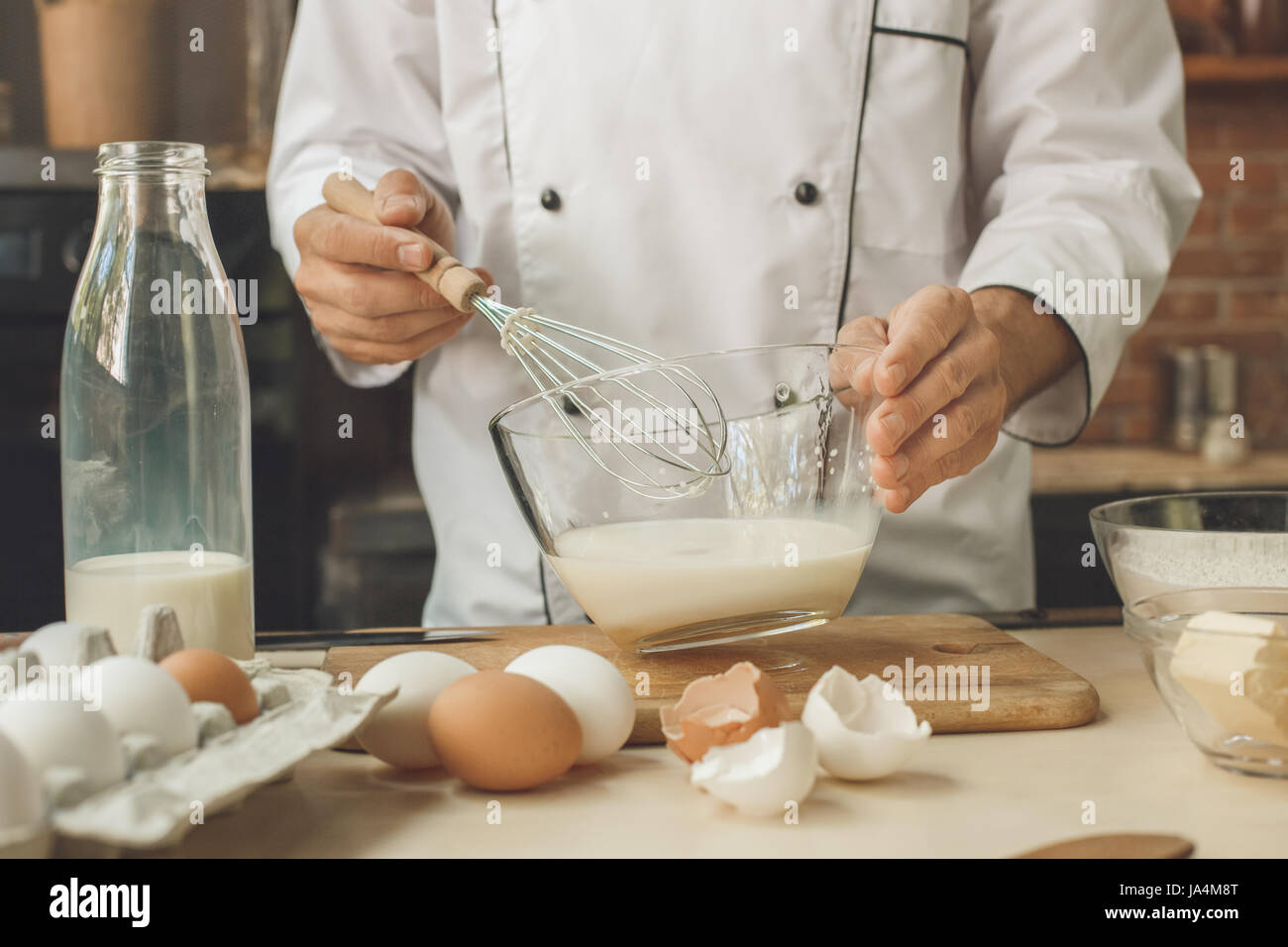 Bakery chef cooking bake in the kitchen professional Stock Photo - Alamy