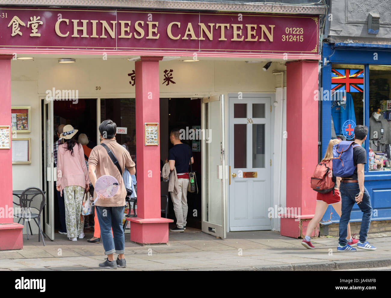Chinese tourists outside the 'Chinese Canteen', Cambridge, England