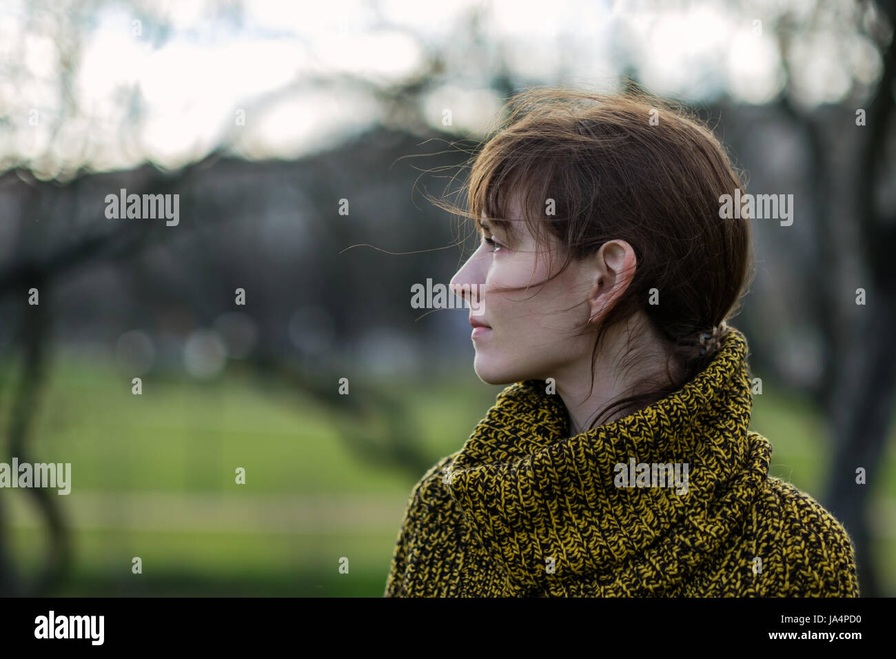 Portrait of a lonely girl in profile. Stock Photo
