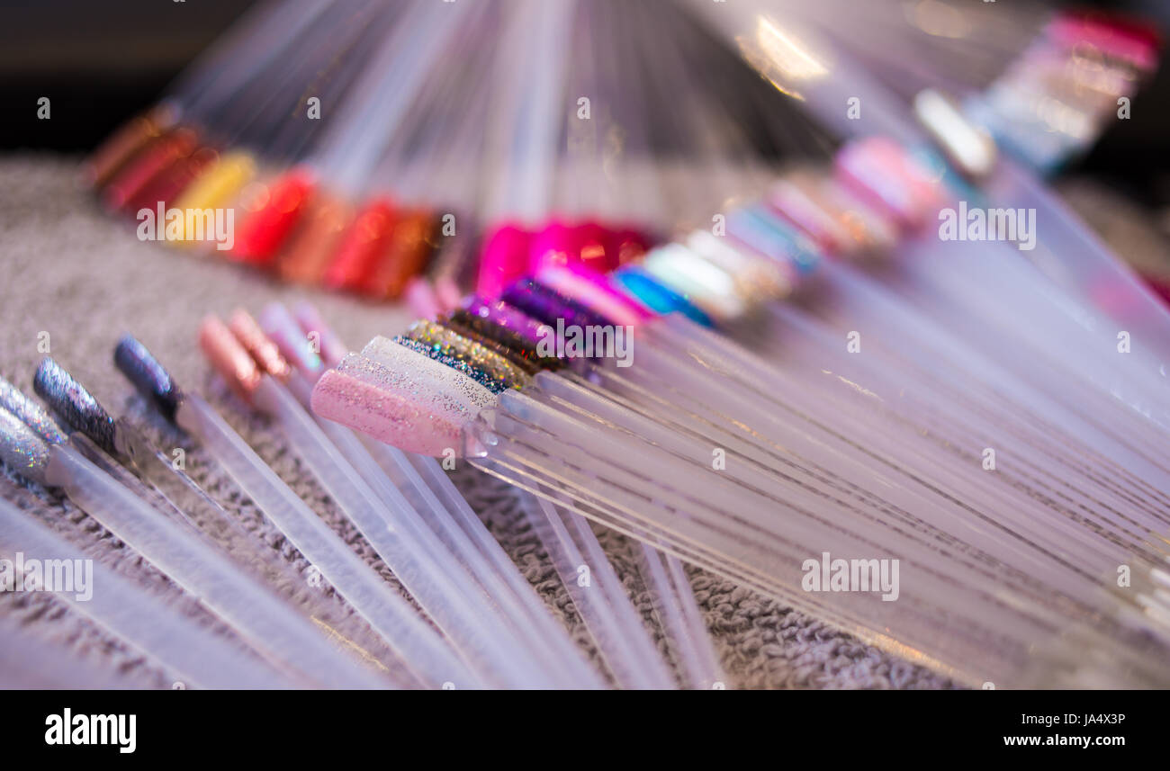 Colourful selection of nail polish colour options on display in a nail