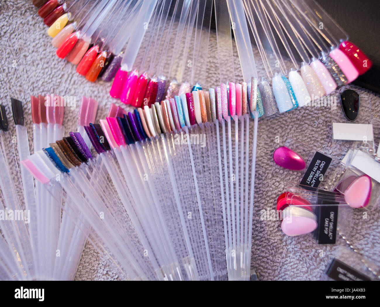 Colourful selection of nail polish colour options on display in a nail salon. Stock Photo