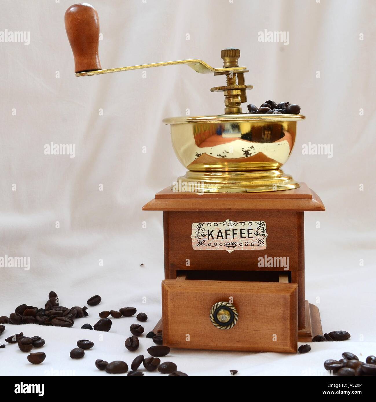 Kaffeemuehle mit Kaffeebohnen - quadratisches Format Stock Photo