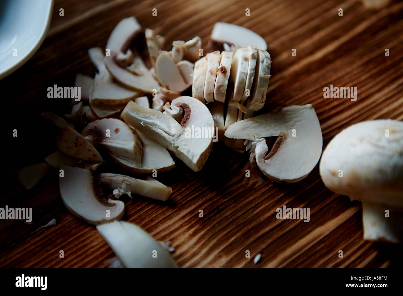 The process of cooking. mushrooms whole and sliced Stock Photo - Alamy