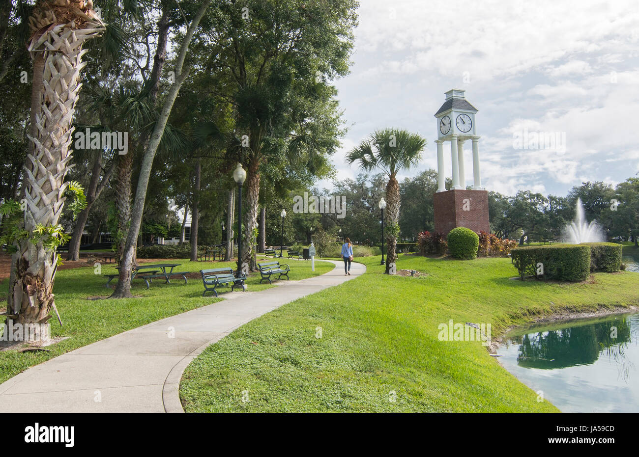 Lake Mary Florida downtown woman walking in park Central Park at Clock