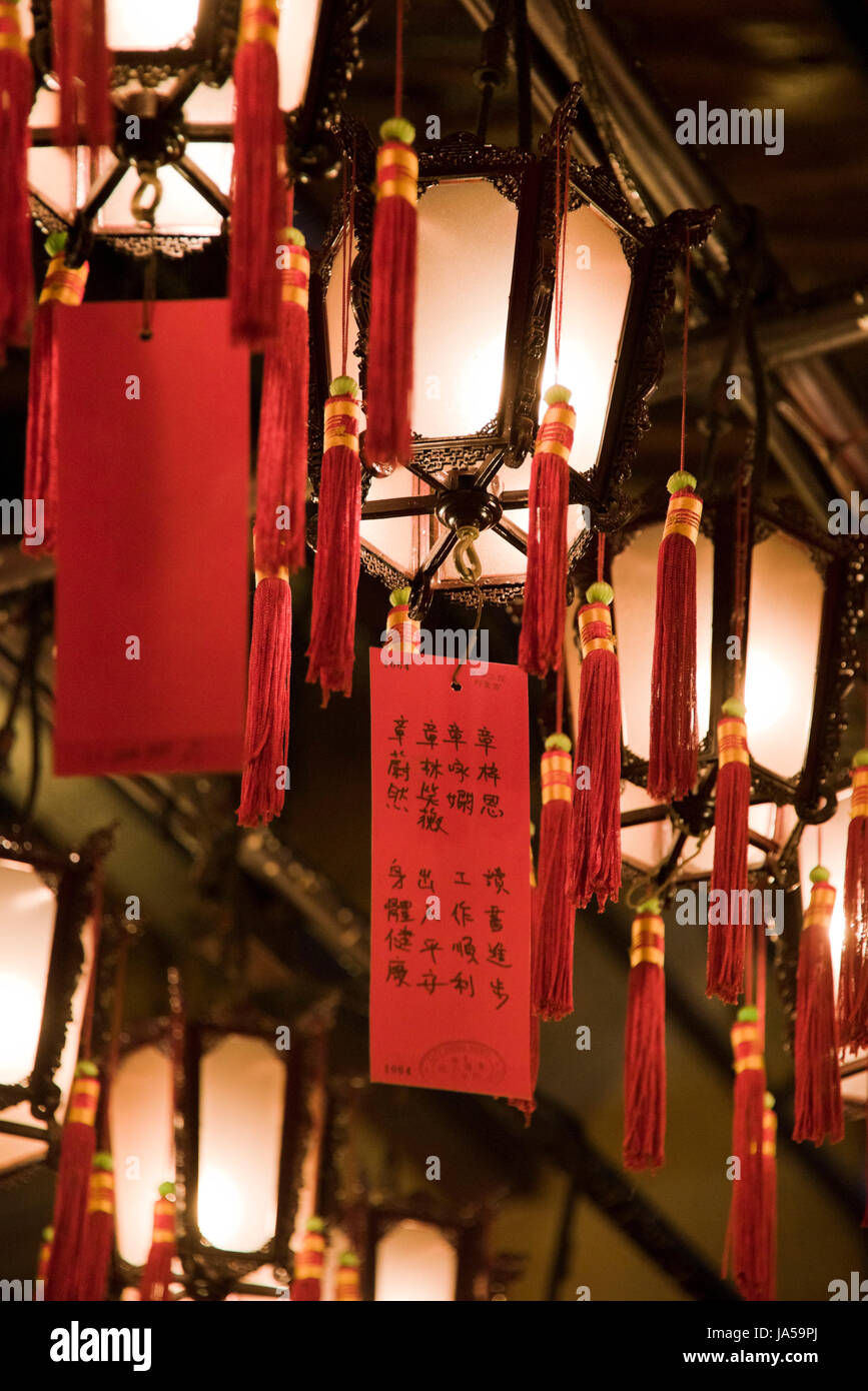 Vertical view of prayers tied to decorative lanterns inside the Man Mo temple in Hong Kong, China. Stock Photo