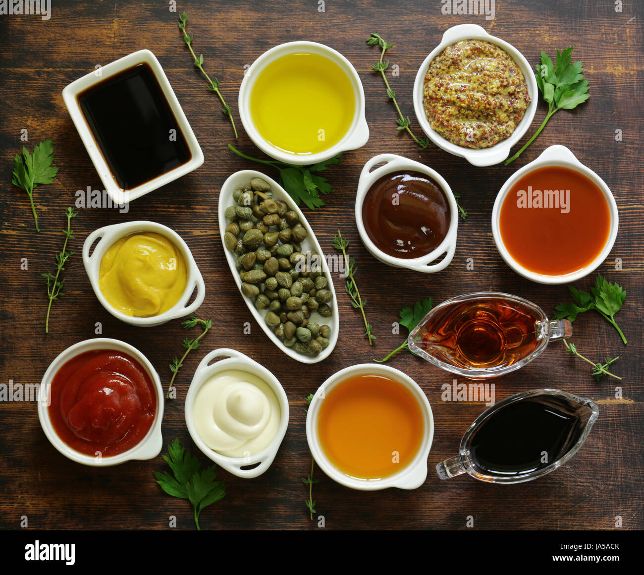 Different types of sauces and oils in bowls, top view Stock Photo Alamy