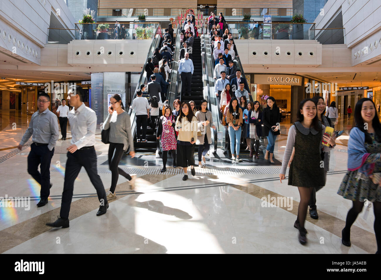 Horizontal view of people on the escalators at the Elements shopping mall in Hong Kong, China. Stock Photo
