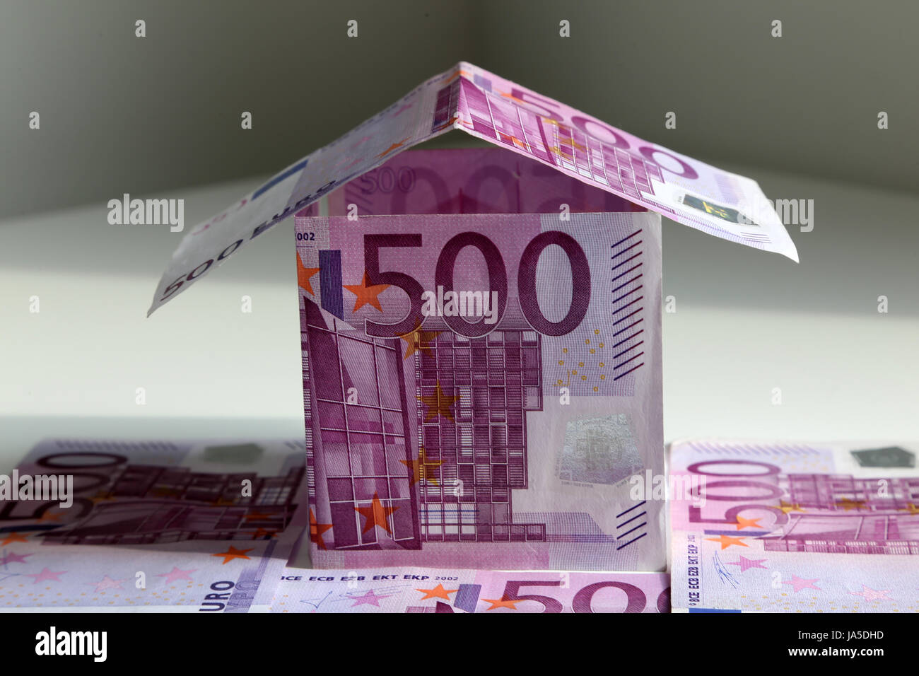 A house bulit from 500 Euro bills, symbol of building a house and paying mortgage Stock Photo