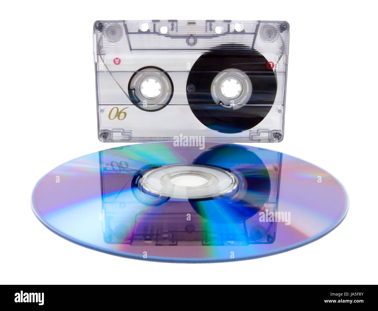 Analog audio tape cassette and digital compact disc isolated on a white