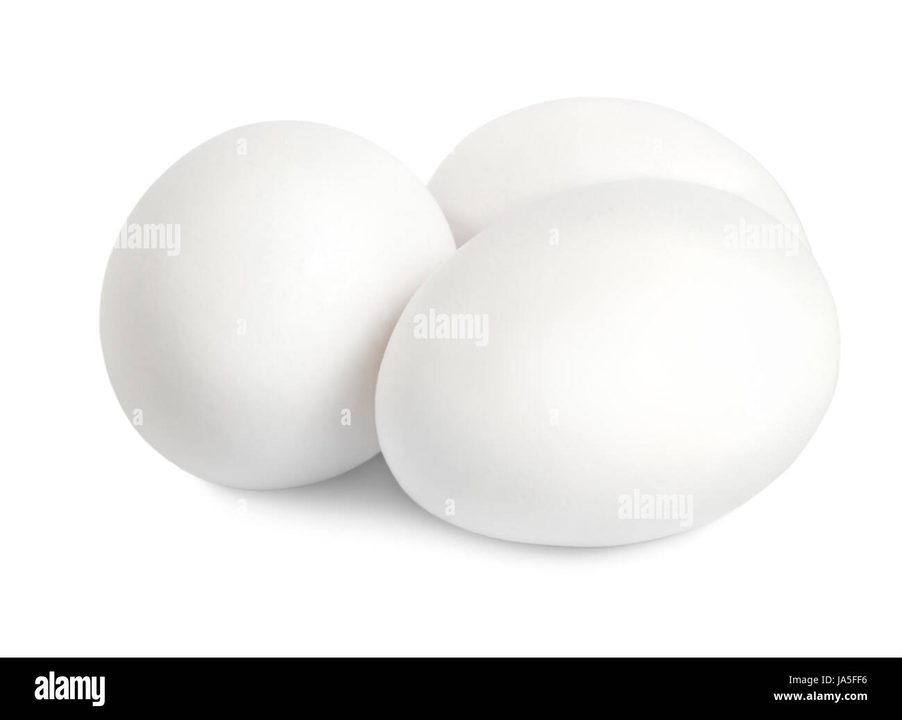 Three white eggs isolated on a white background Stock Photo - Alamy