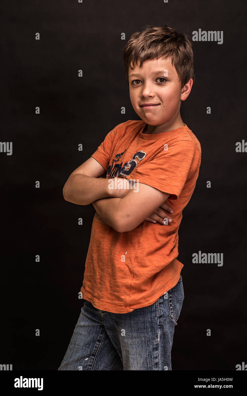 A boy portrait, young little cute and adorable man, little obstreperous scamp. Stock Photo