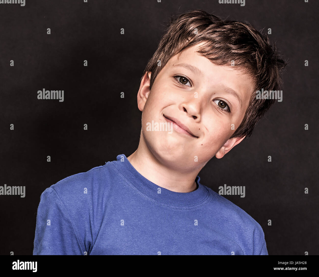A boy portrait, young little cute and adorable man, little obstreperous scamp. Stock Photo