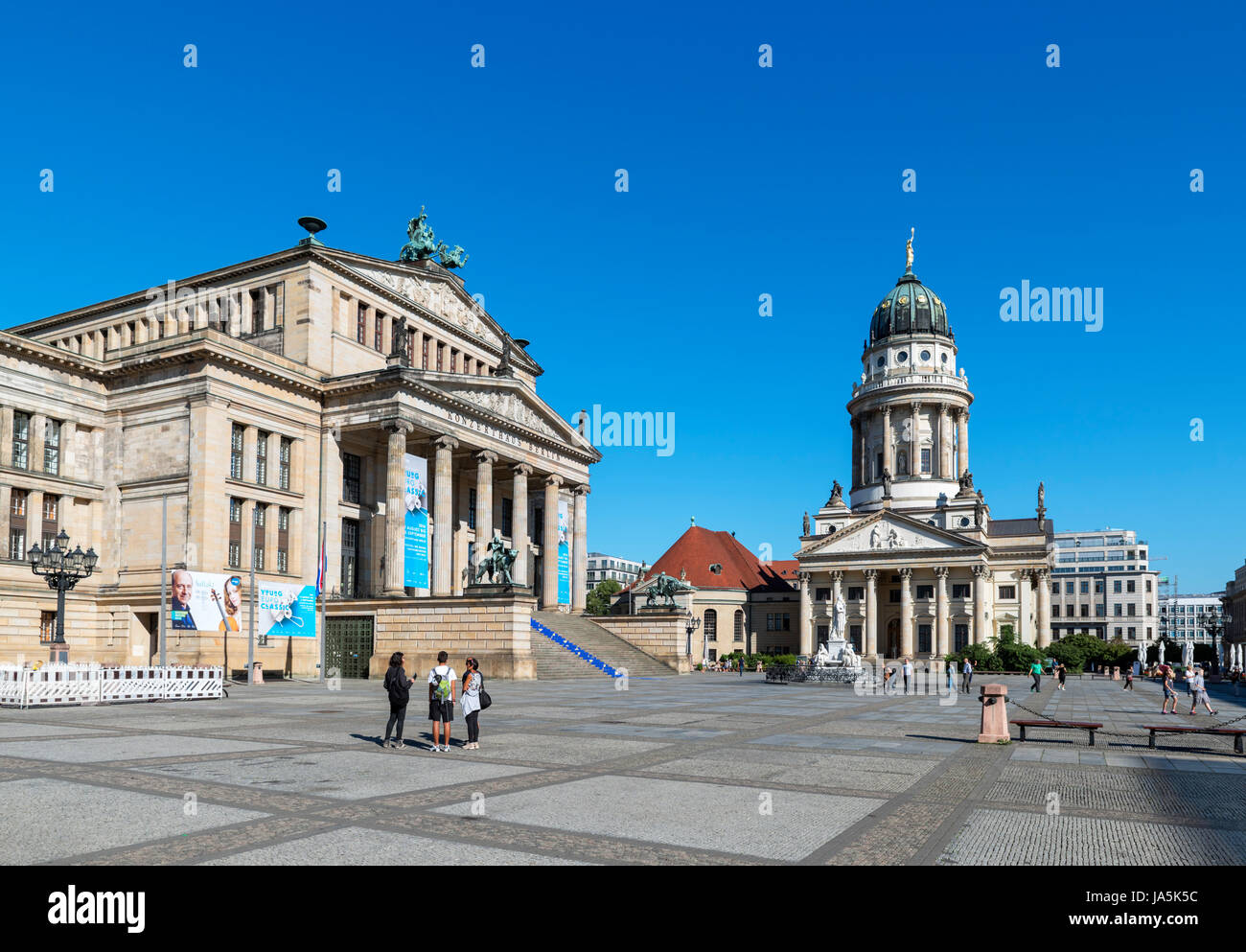 The Gendarmenmarkt with the Franzosischer Dom to the right and Konzerthaus on the left, Friedrichstadt district, Berlin, Germany Stock Photo