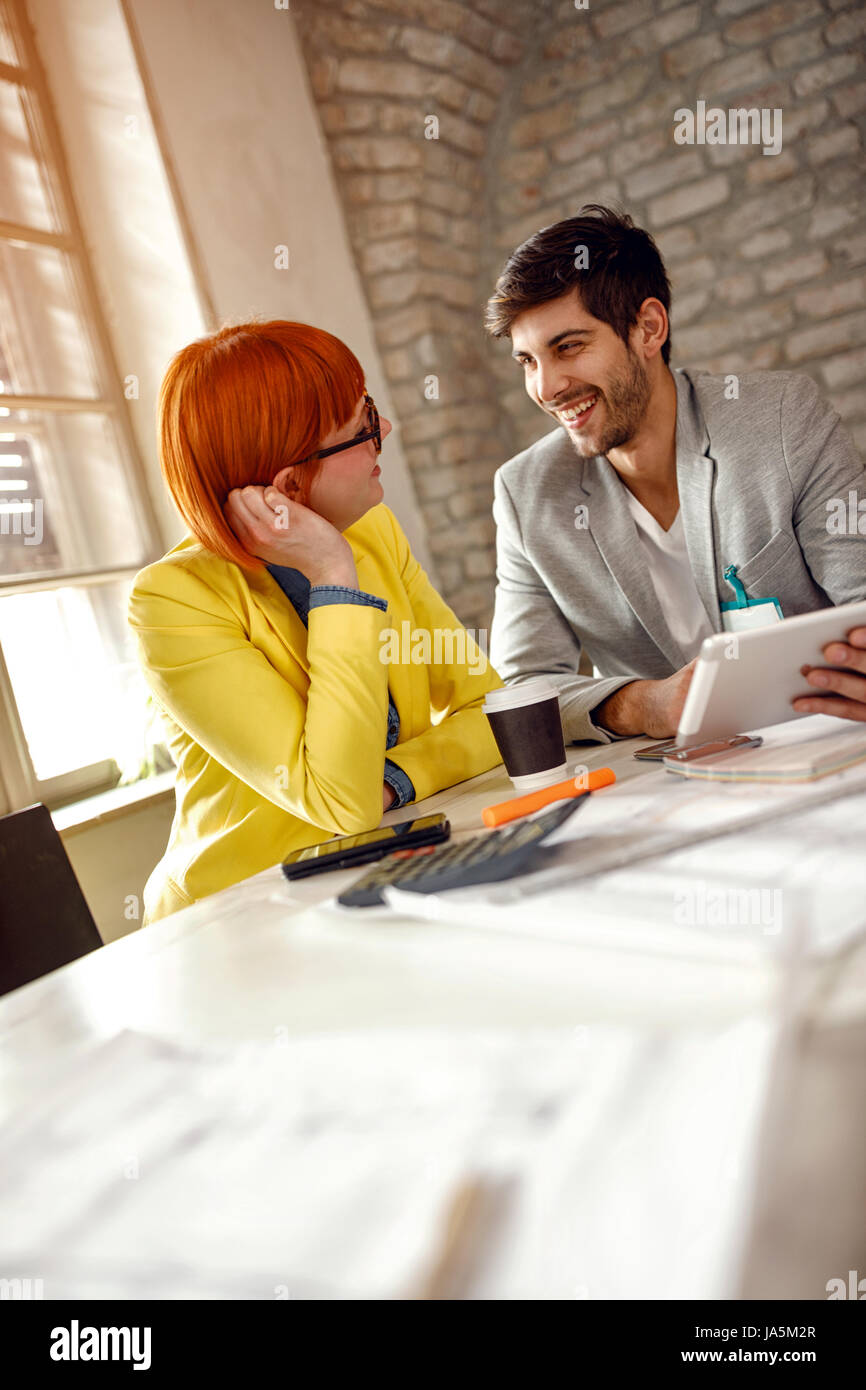 Working on design- designers enjoying working on project together Stock ...