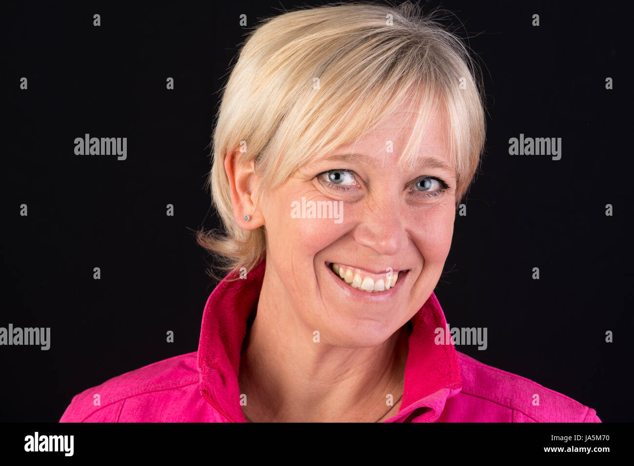 Beautiful european mature woman in pink soft shell portrait Stock Photo