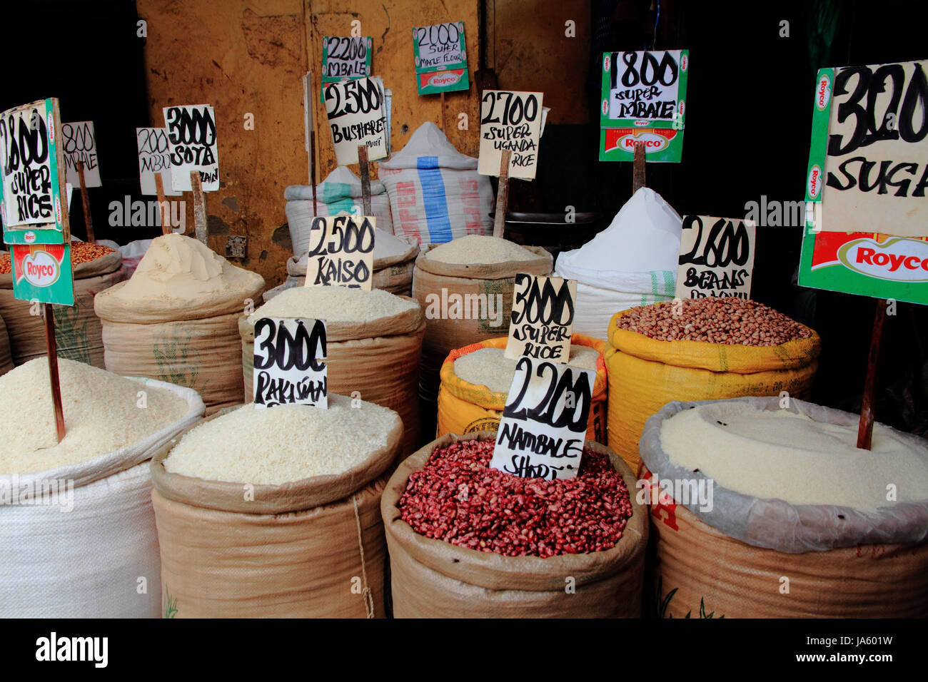 Bags of Rice Beans and Sugar, with prices, in a market in Kampala