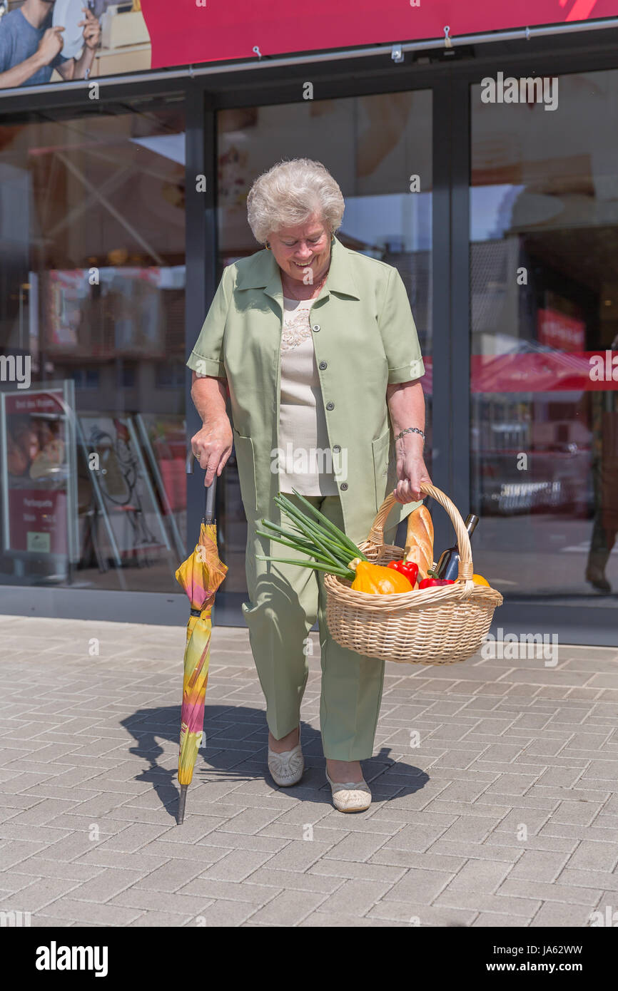 woman, lady, entrance, door, basket, shopping, walk, seniors, senior citizens, Stock Photo