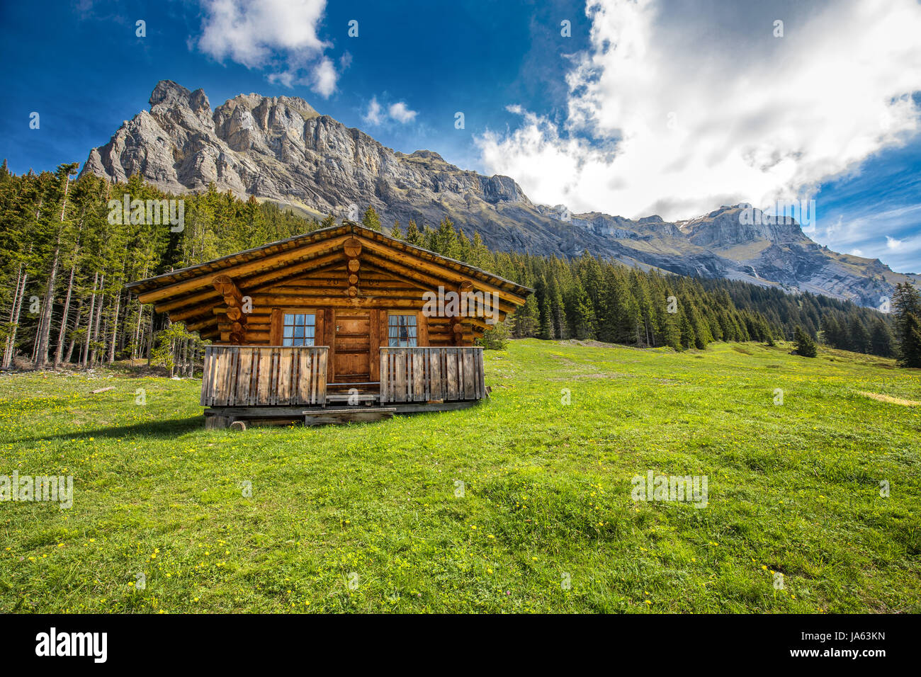 Wooden Swiss chalet in Swiss Alps near Kandersteg and Oeschinnensee, Canton Bern, Switzerland, Europe. Stock Photo