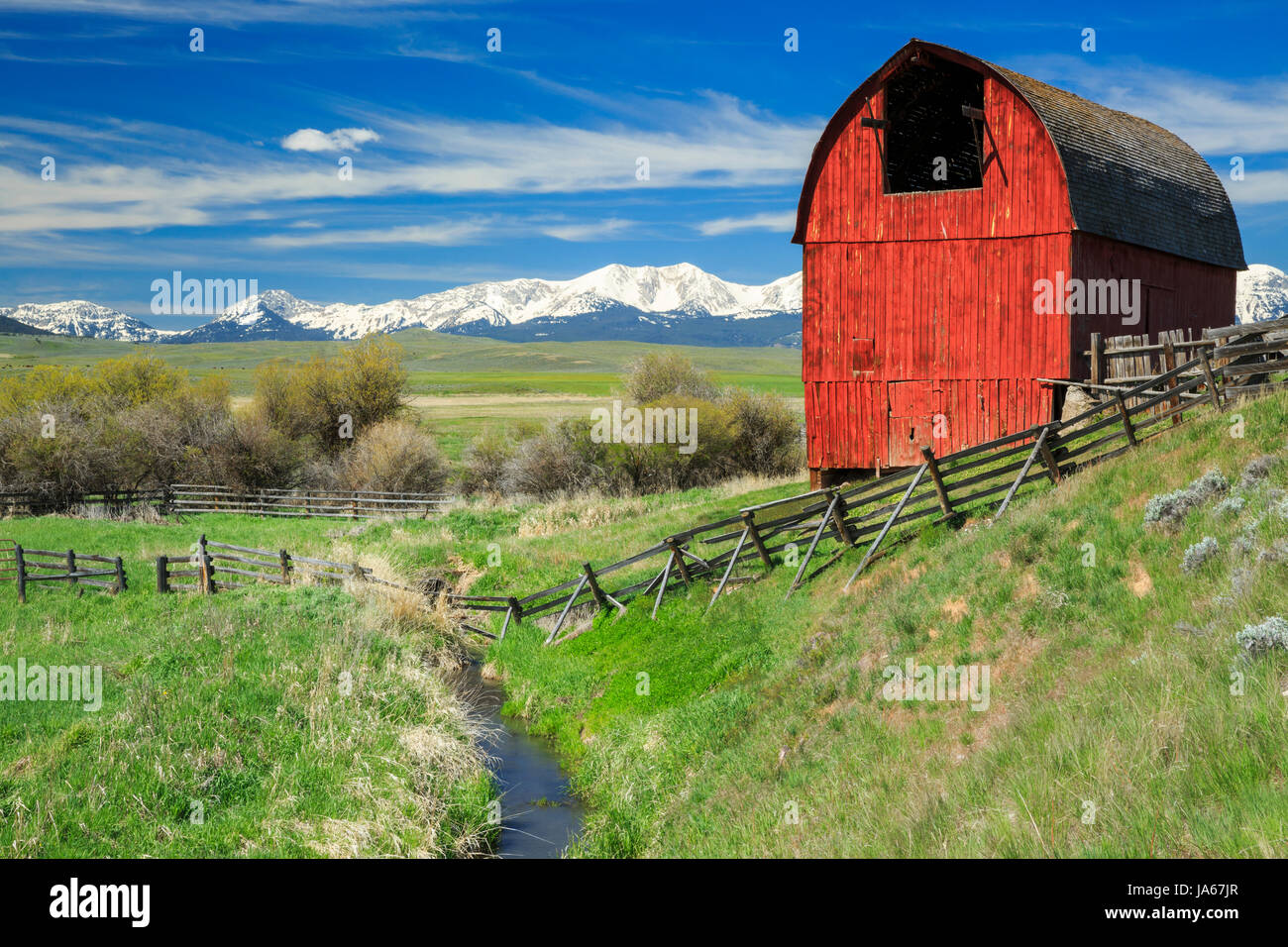 old red barn below the bridger range near wilsall, montana Stock Photo