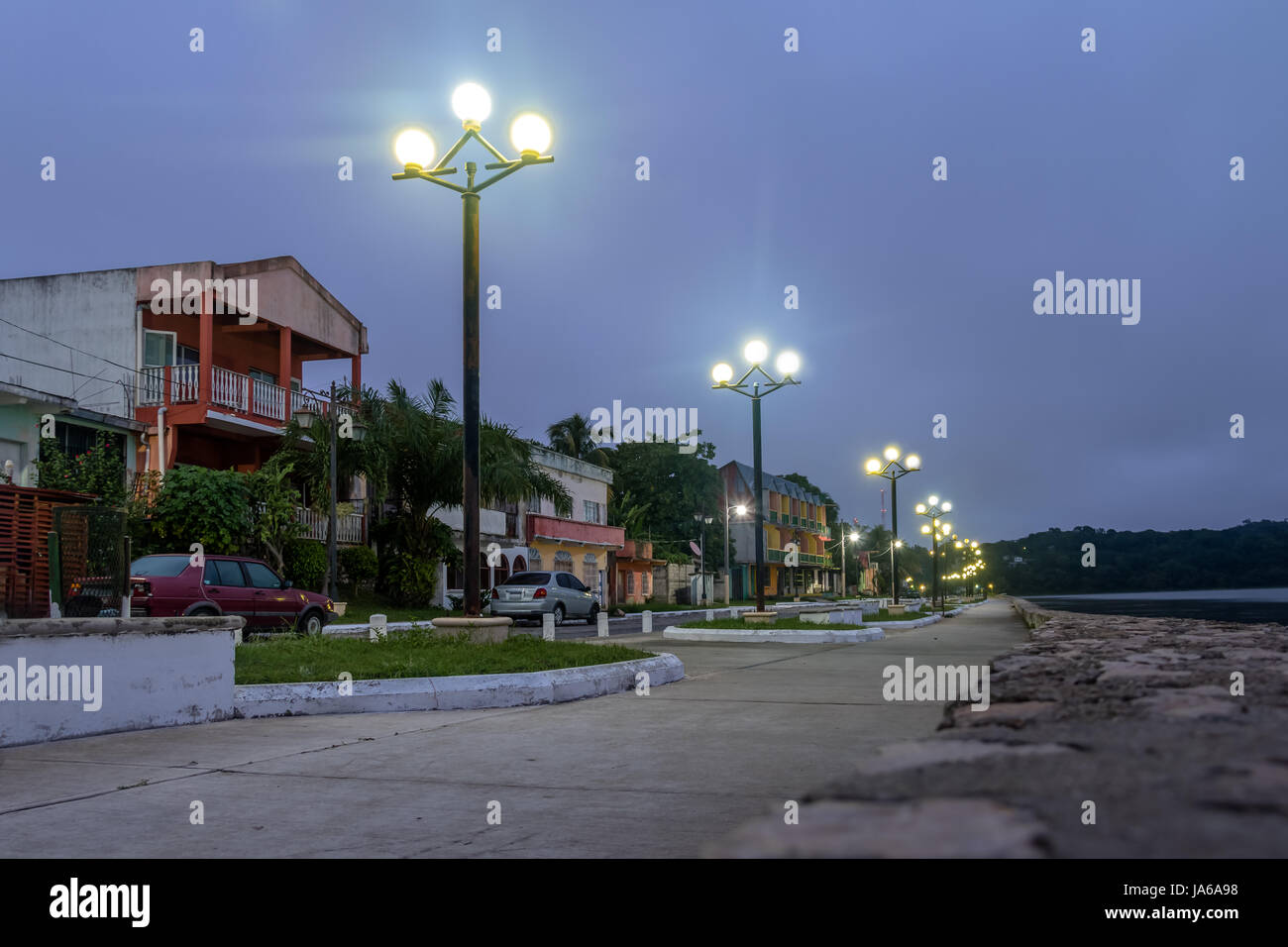 Waterfront street at night - Flores, Peten, Guatemala Stock Photo