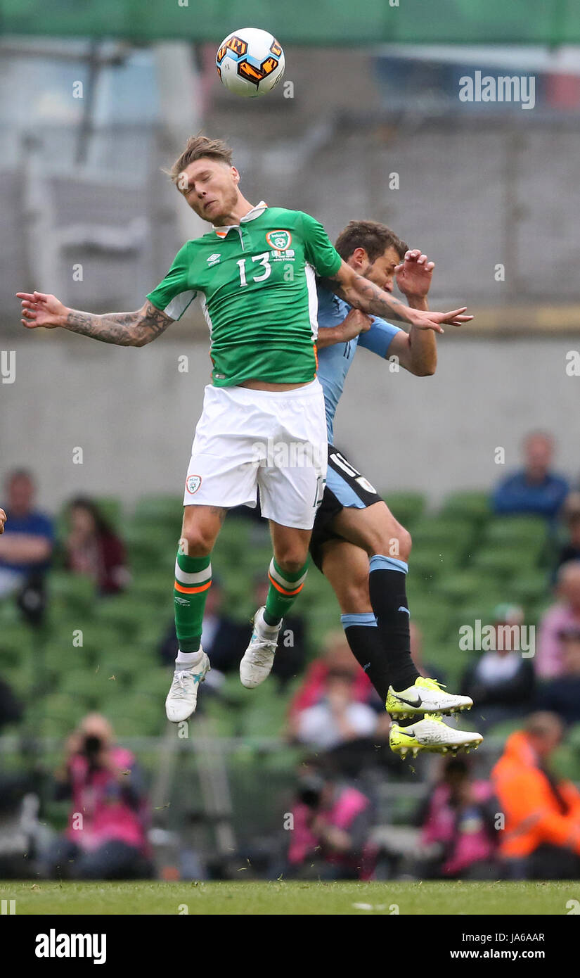 Republic of Ireland's Jeff Hendrick and Uruguay's Cristhian Stuani battle for the ball during the international friendly at The Aviva Stadium, Dublin. Stock Photo