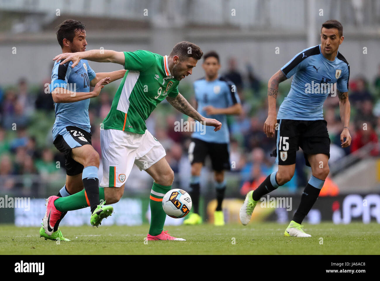 Uruguay's Alvaro Gonzalez and Republic of Ireland's Daryl Murphy battle for the ball during the international friendly at The Aviva Stadium, Dublin. Stock Photo