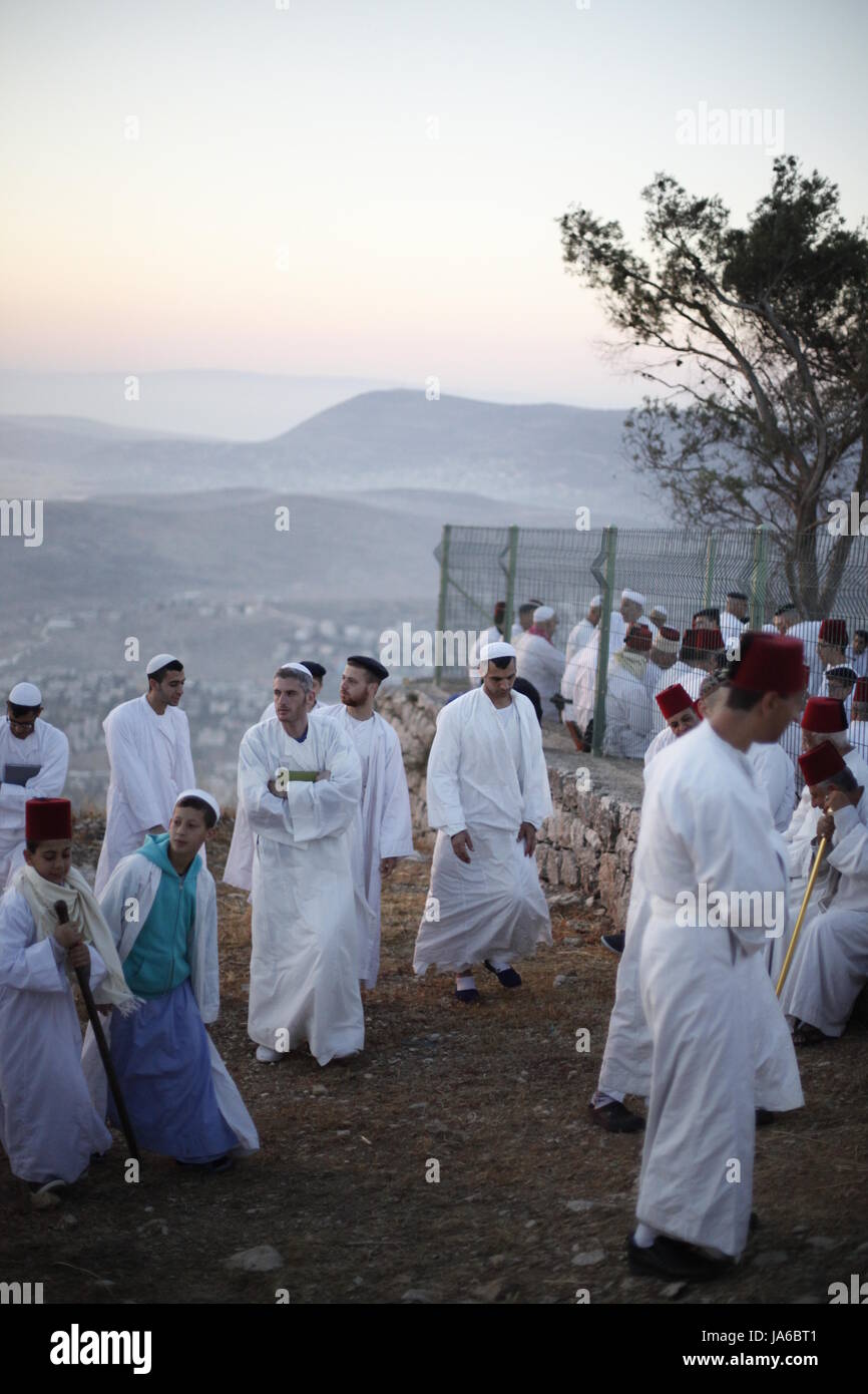 Samaritans participate in a traditional ceremony celebrating the giving of the Torah on 'Shavuot festival', atop Mount Gerizim near the West Bank city of Nablus. Shavuot Festival, known as the Feast of Weeks and as Pentecost in ancient Greek, is a Jewish holiday that occurs on the sixth day of the Hebrew month of Sivan. The Samaritan is a religious group that split from Judaism by the second century B.C.E. The Samaritans retained the Torah, the Five Books of Moses, as their Scripture. The Samaritan Bible refers to Mt. Gerizim, not Jerusalem, as the center of worship. (Photo by Yunjie Liao/ Pac Stock Photo