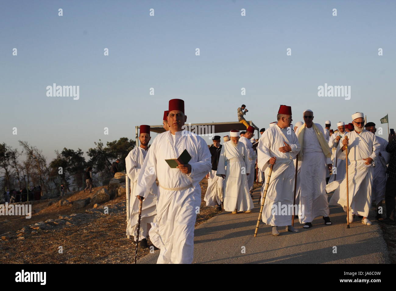 Samaritans participate in a traditional ceremony celebrating the giving of the Torah on 'Shavuot festival', atop Mount Gerizim near the West Bank city of Nablus. Shavuot Festival, known as the Feast of Weeks and as Pentecost in ancient Greek, is a Jewish holiday that occurs on the sixth day of the Hebrew month of Sivan. The Samaritan is a religious group that split from Judaism by the second century B.C.E. The Samaritans retained the Torah, the Five Books of Moses, as their Scripture. The Samaritan Bible refers to Mt. Gerizim, not Jerusalem, as the center of worship. (Photo by Yunjie Liao/ Pac Stock Photo