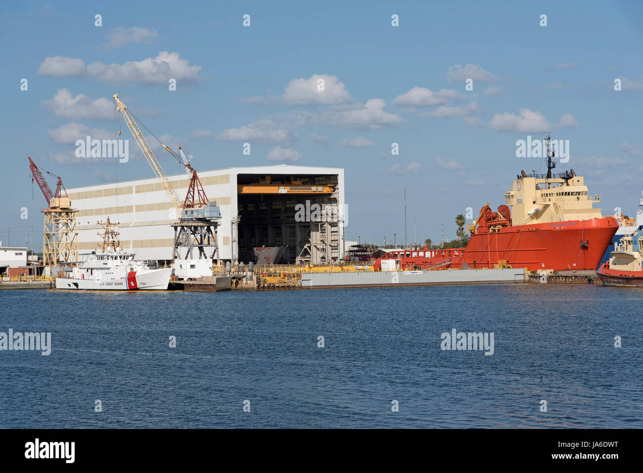 Tugs and offshore supply ships alongside in the Port of Tampa Florida USA. April 2017 Stock Photo