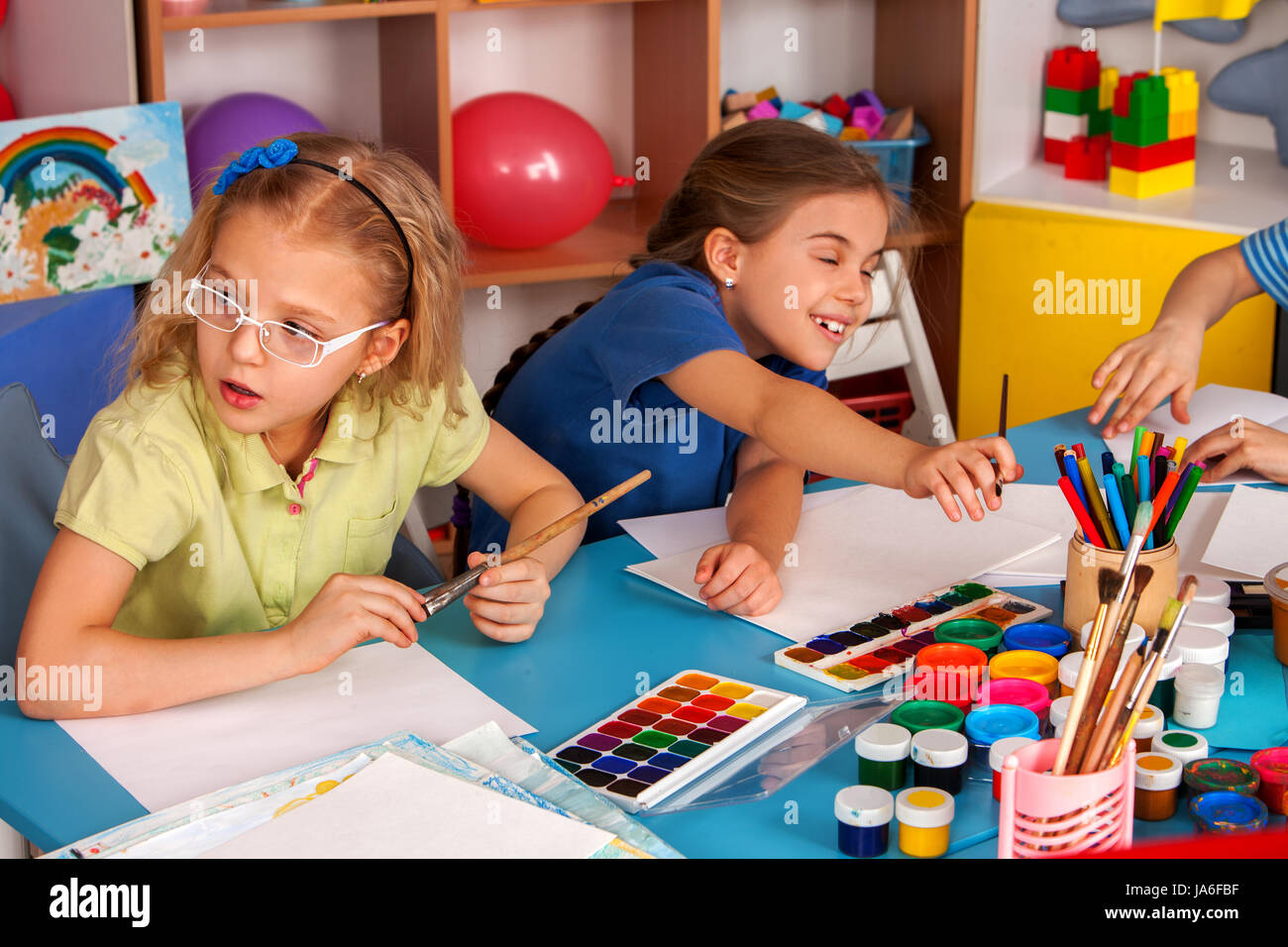 Small students children painting in art school class Stock Photo - Alamy