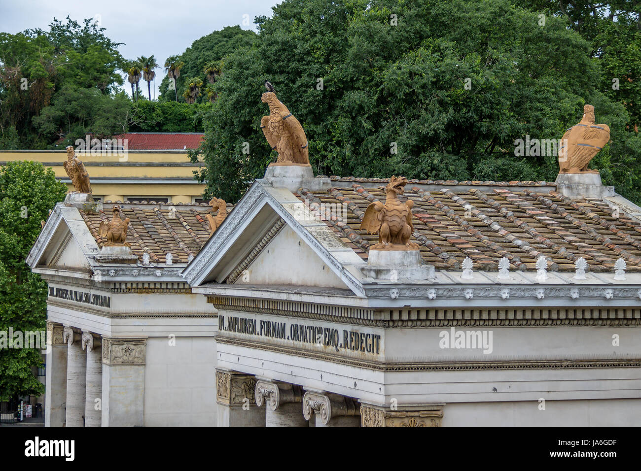 Gates to Villa Borghese with a latin quote dedicated to its expansion - entrance from Piazzale Flaminio near Piazza del Popolo  - Rome, Italy Stock Photo