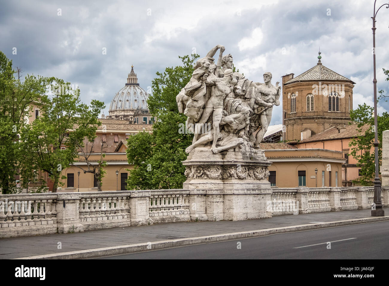 Famous Statue of the Ponte Vittorio Emanuele II and St. Peter's basilica dome  - Rome, Italy Stock Photo