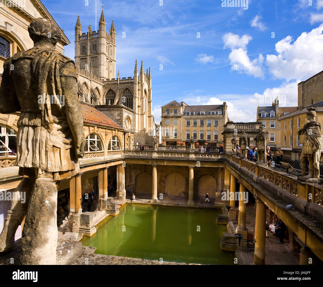 Roman Baths In Bath England, with Bath Abbey behind. Stock Photo
