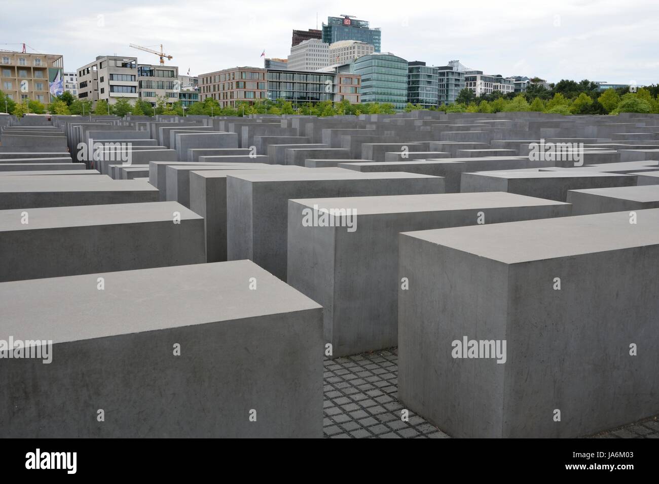 BERLIN, GERMANY - AUGUST 18:The Memorial of the murdered Jews of Europe in Berlin, Germany on August 18, 2013. The site contains 2,711 concrete blocks and was designed by Peter Eisenman and Buro Happold. Foto taken from Gertrud-Kolmar street with view to the memorial. Stock Photo